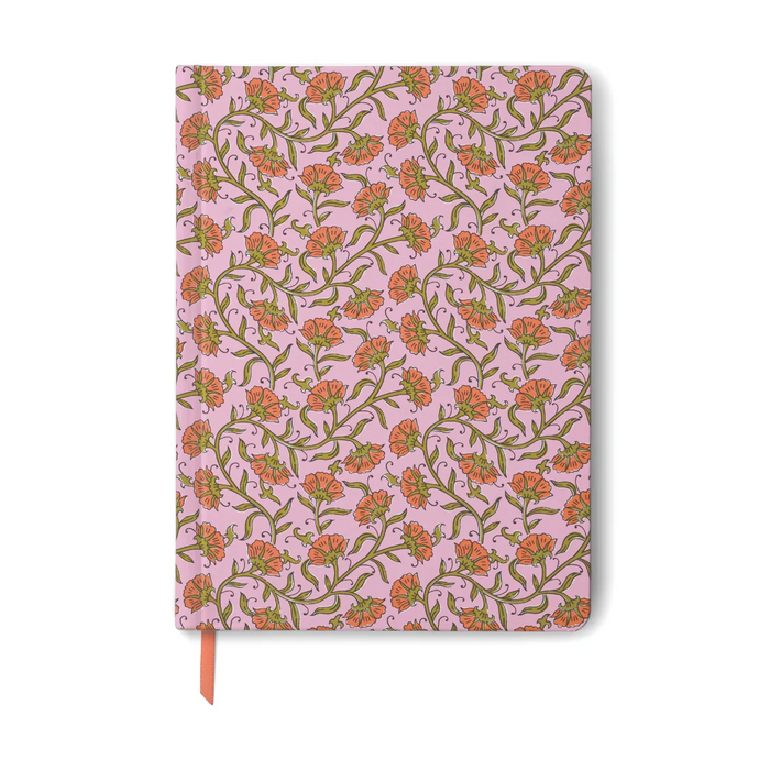 Notebook with floral pattern on a pink background
