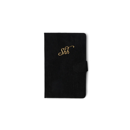 A black textured folio-style notebook or wallet with a gold cursive 'Shh' monogram on the front and a side tab closure, shown on a plain white background.