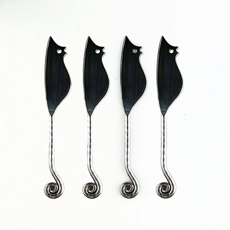 Four stainless steel mouse shaped slice tools on a white background