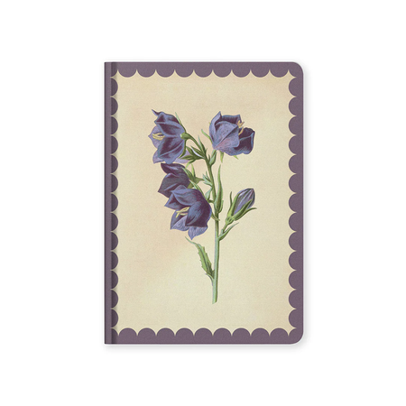 Notebook with purple floral design on a beige background