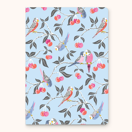 Notebook with bird and cherry pattern on a light blue background
