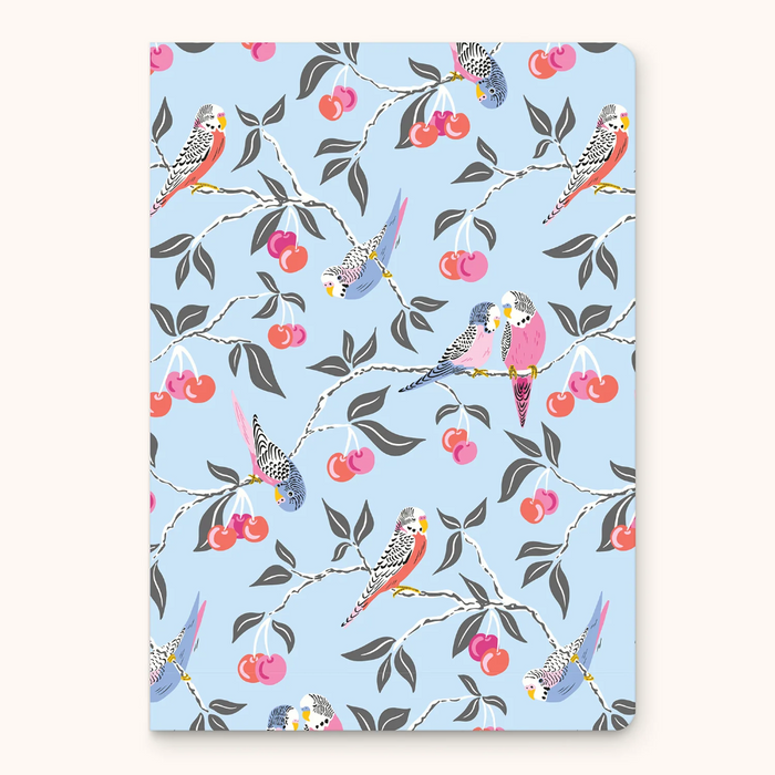 Notebook with bird and cherry pattern on a light blue background