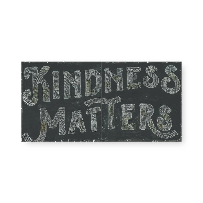 Black sign with 'Kindness Matters' text on a white background