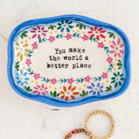small blue lined trinket dish that says "you make the world a better place" featuring a floral pattern
