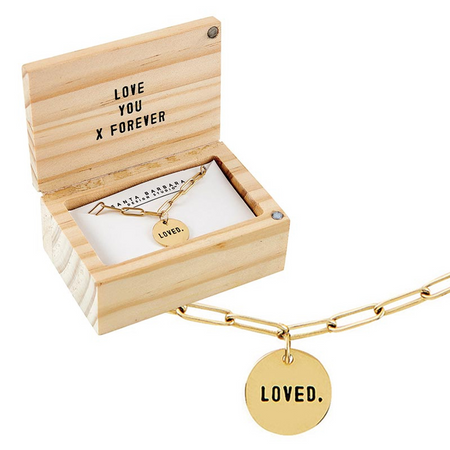 Gold necklace with 'LOVED.' charm in a wooden box with 'LOVE YOU FOREVER' text