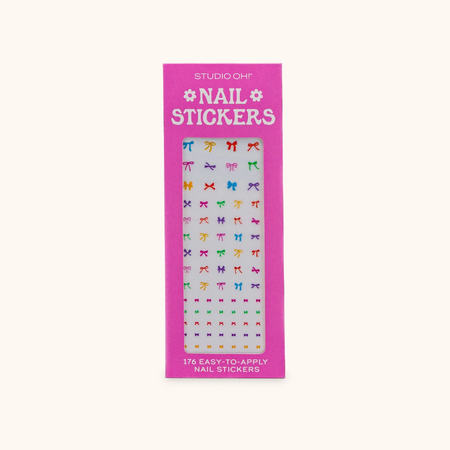 Pack of nail stickers with colorful designs on a pink background