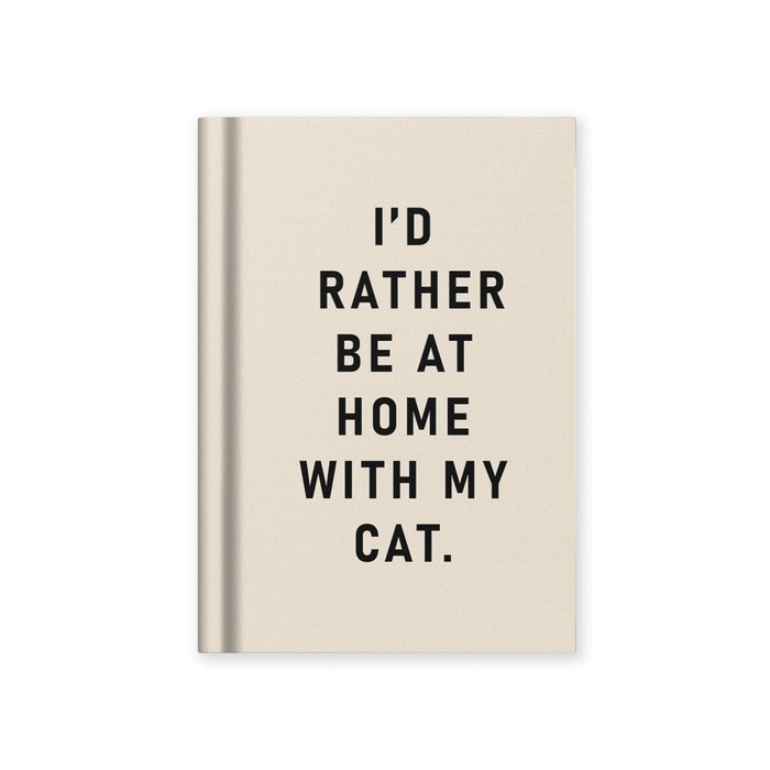 Beige notebook with text 'I'd rather be at home with my cat' on a white background
