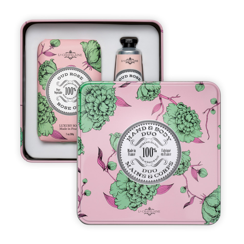 Hand and body care set with floral design packaging on a white background