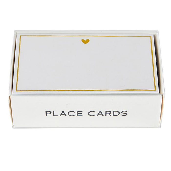 A white gift box with gold foil place cards, featuring a subtle heart design on each card.