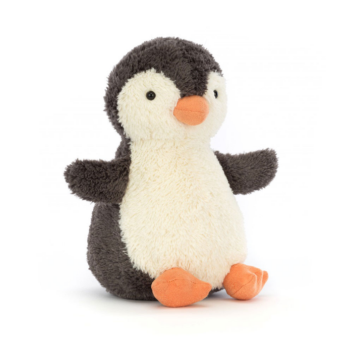 Stuffed penguin toy on a white background