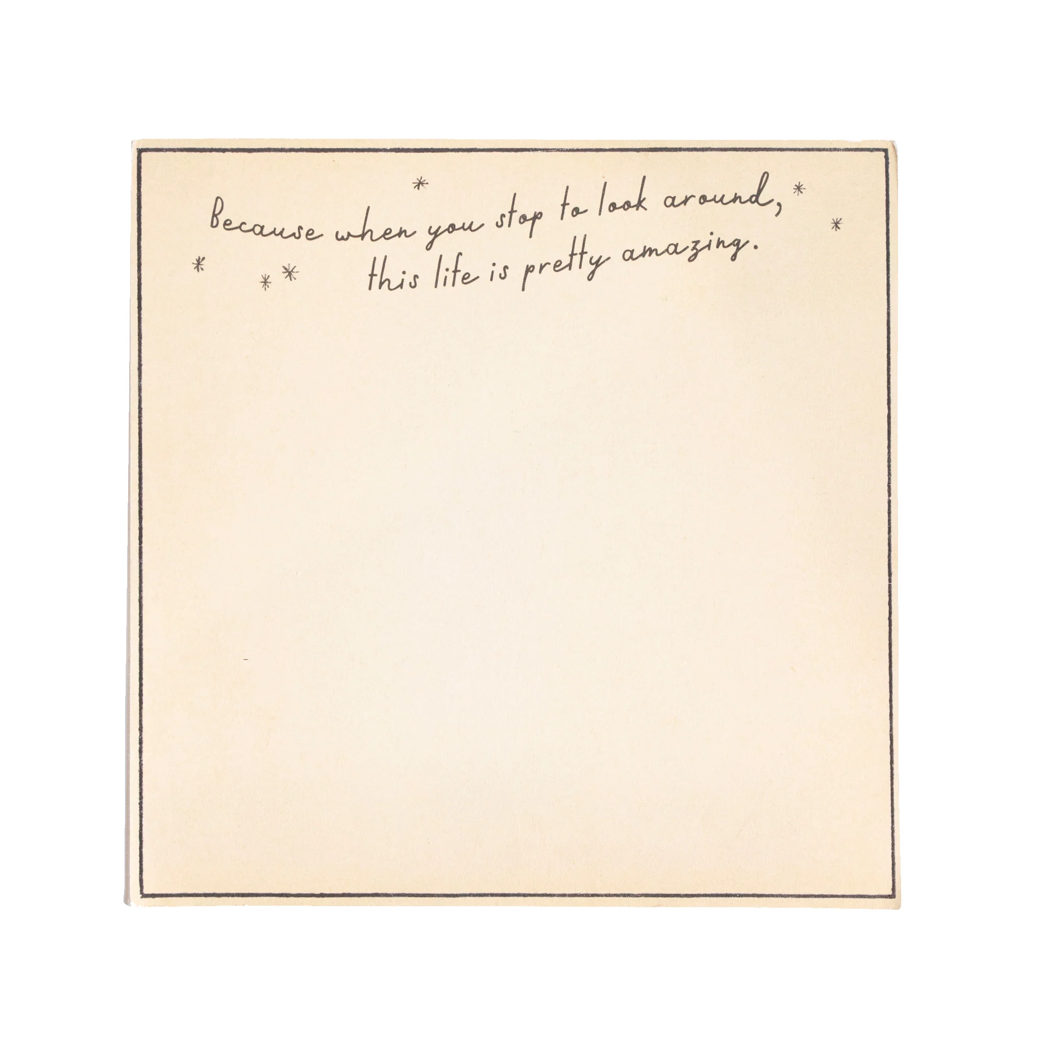 Beige notepad with handwritten text on a white background