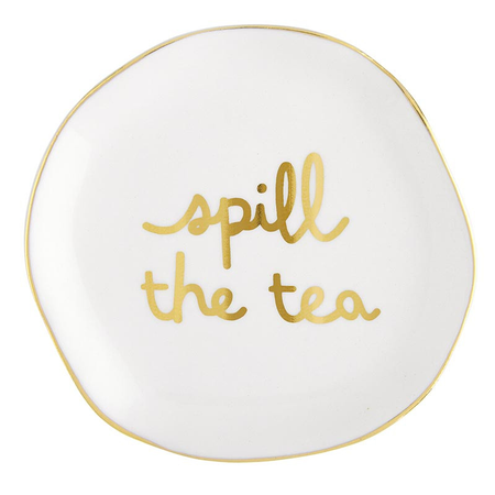 ceramic tea bag rest that reads "spill the tea" in gold foil on a white background