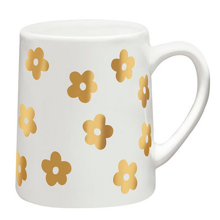 White mug with gold floral patterns on a white background