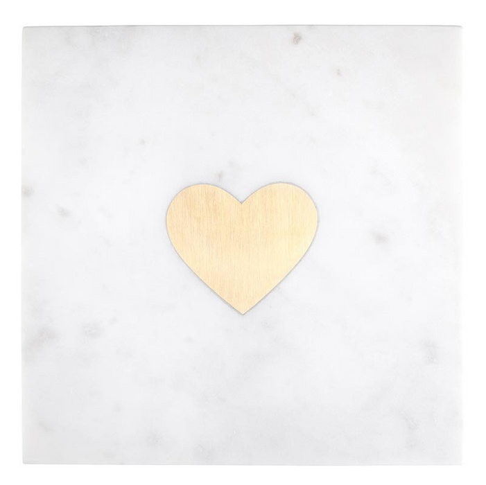 white marble board with a gold heart in the center