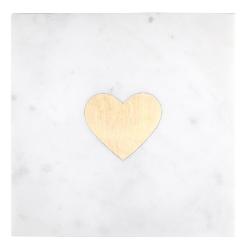 white marble board with a gold heart in the center