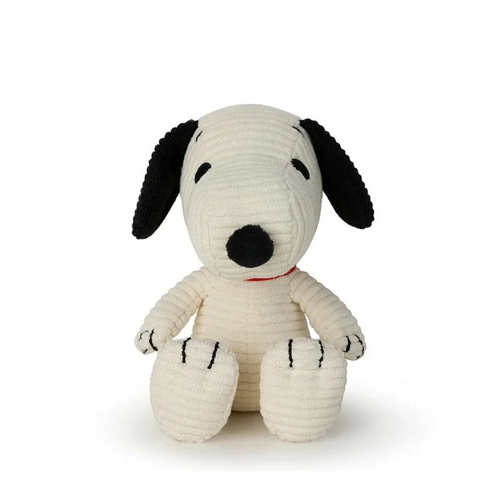 Cream corduroy Snoopy plush sitting upright with black floppy ears, a black nose, and a red collar.