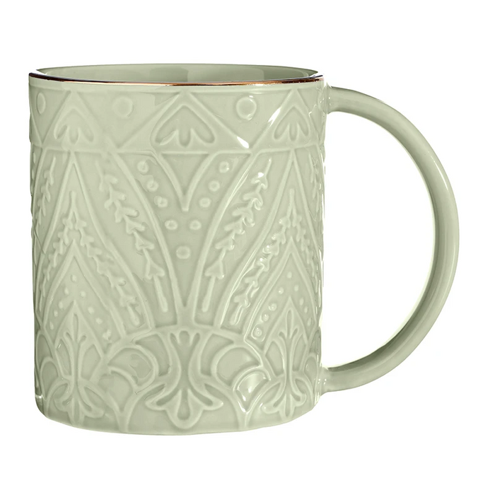A light sage green ceramic mug with an embossed geometric and floral pattern, featuring a thin copper-gold rim and a matching handle, shown on a white background.