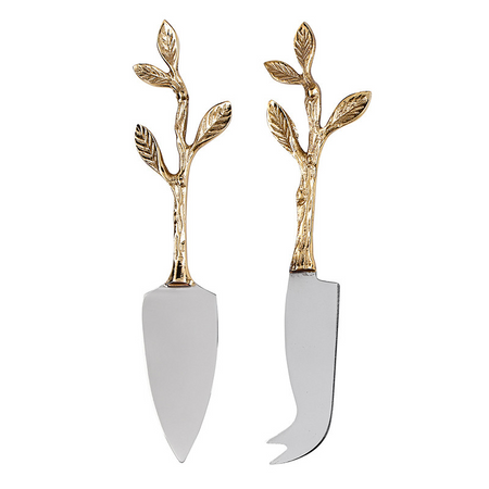 2 cheese knives with gold handles that look like tree branches