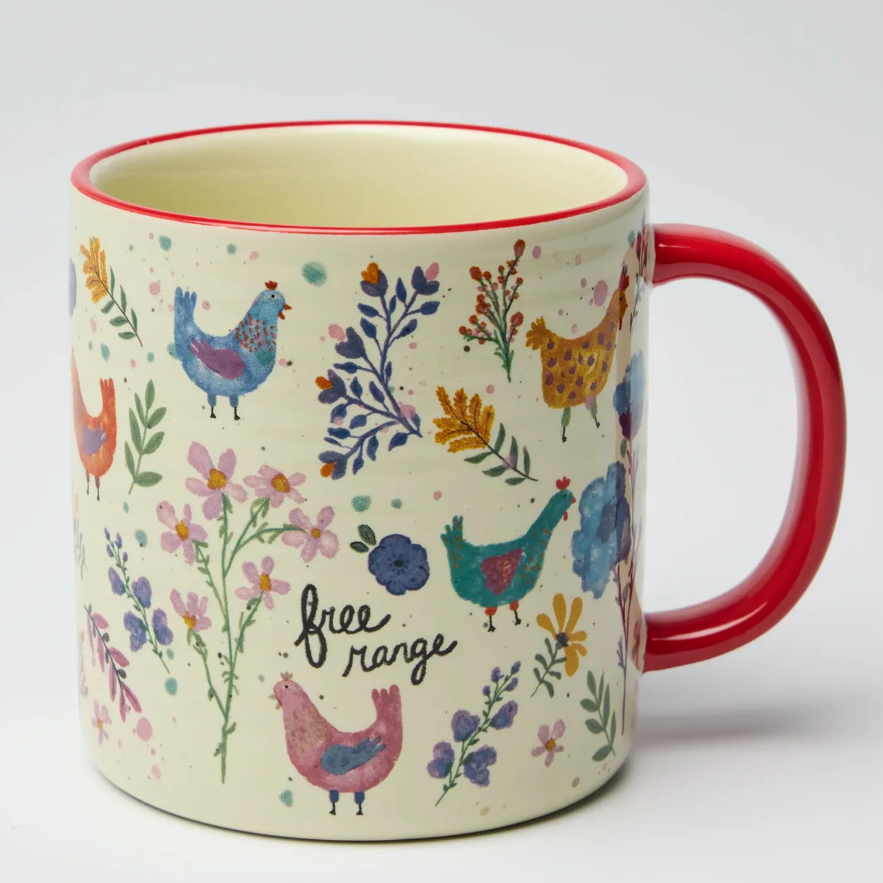 mug with red handle painted flowers and chickens that says "free Range" in a black script font