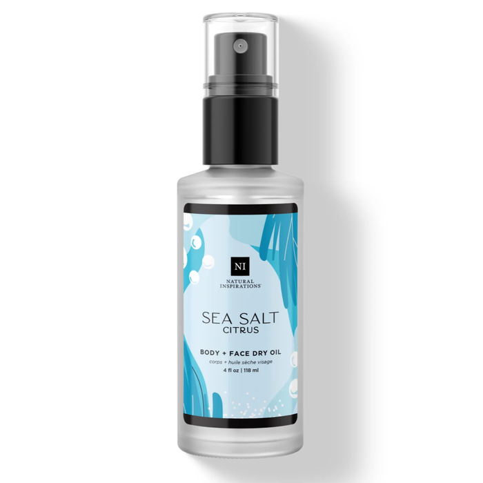 Sea Salt Citrus Body + Face Dry Oil in a frosted bottle with a blue label, black spray pump, and clear cap.