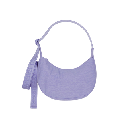 Purple crescent bag with a strap on a white background