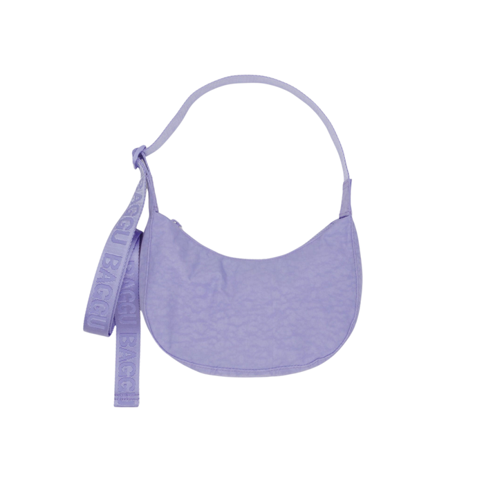 Purple crescent bag with a strap on a white background