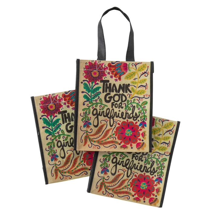 Colorful tote bag with floral designs and text on a white background
