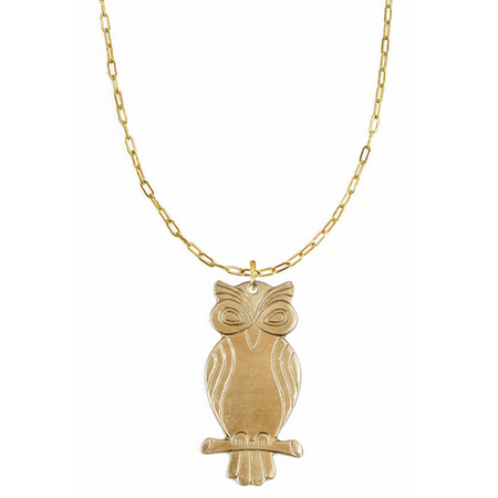 Gold owl pendant necklace on a white background