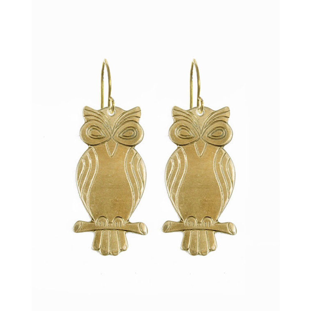 Gold owl-shaped earrings on a white background