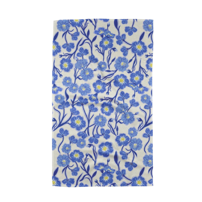 Floral patterned fabric with blue flowers on a white background