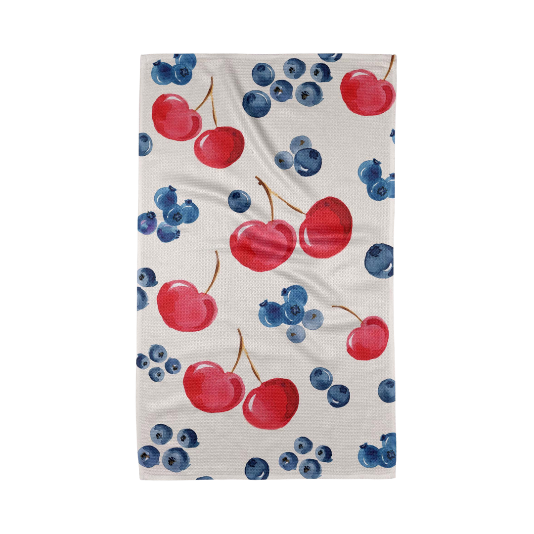 Towel with red cherries and blueberries pattern on a white background