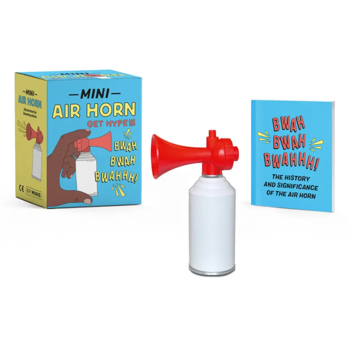 A mini air horn toy set on a white background, featuring a red and white air horn bottle, its blue and yellow retail box, and a matching blue book with comic-style text.
