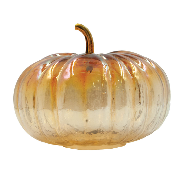 Glass pumpkin on white background