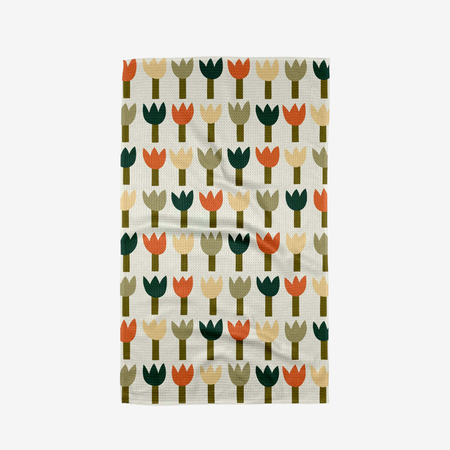 Patterned towel with colorful tulip design on a white background