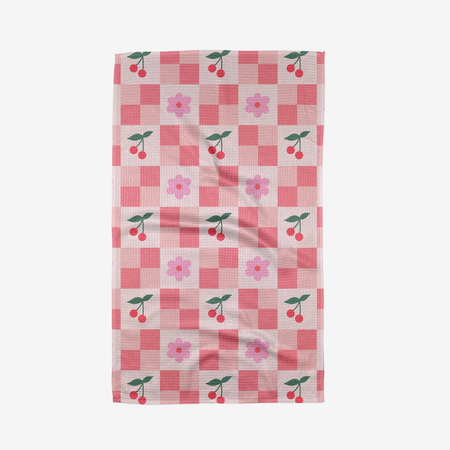 Checkered towel with cherry and flower pattern on a white background