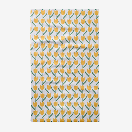 Tea towel with yellow tulip pattern on a white background