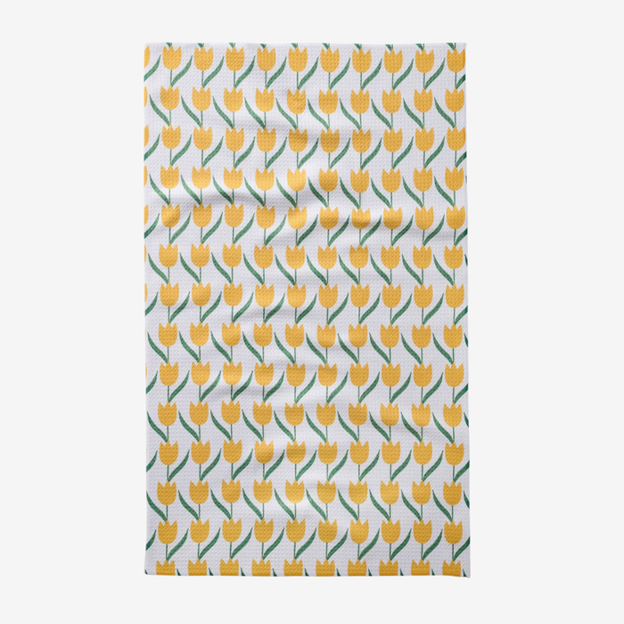 Tea towel with yellow tulip pattern on a white background