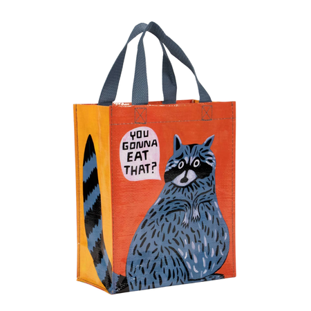 Tote bag with a raccoon illustration and text on an orange background