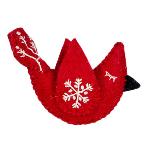 Red bird-shaped ornament with a white snowflake design on a white background