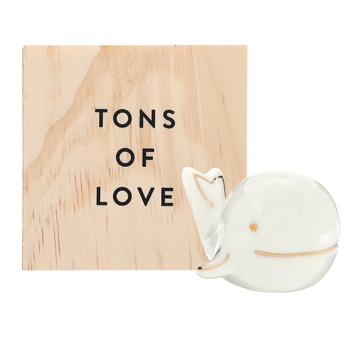 white whale figurine with box that says "tons of love" 