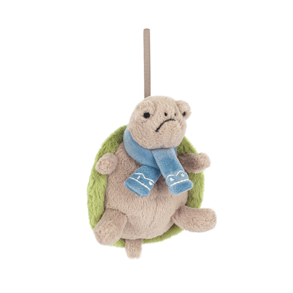 Plush turtle ornament with a blue scarf on a white background
