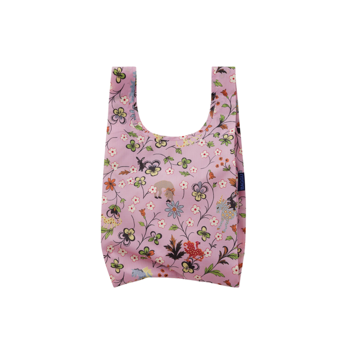 A reusable fabric shopping bag in light pink with an all-over floral and bird print, shown against a plain white background.
