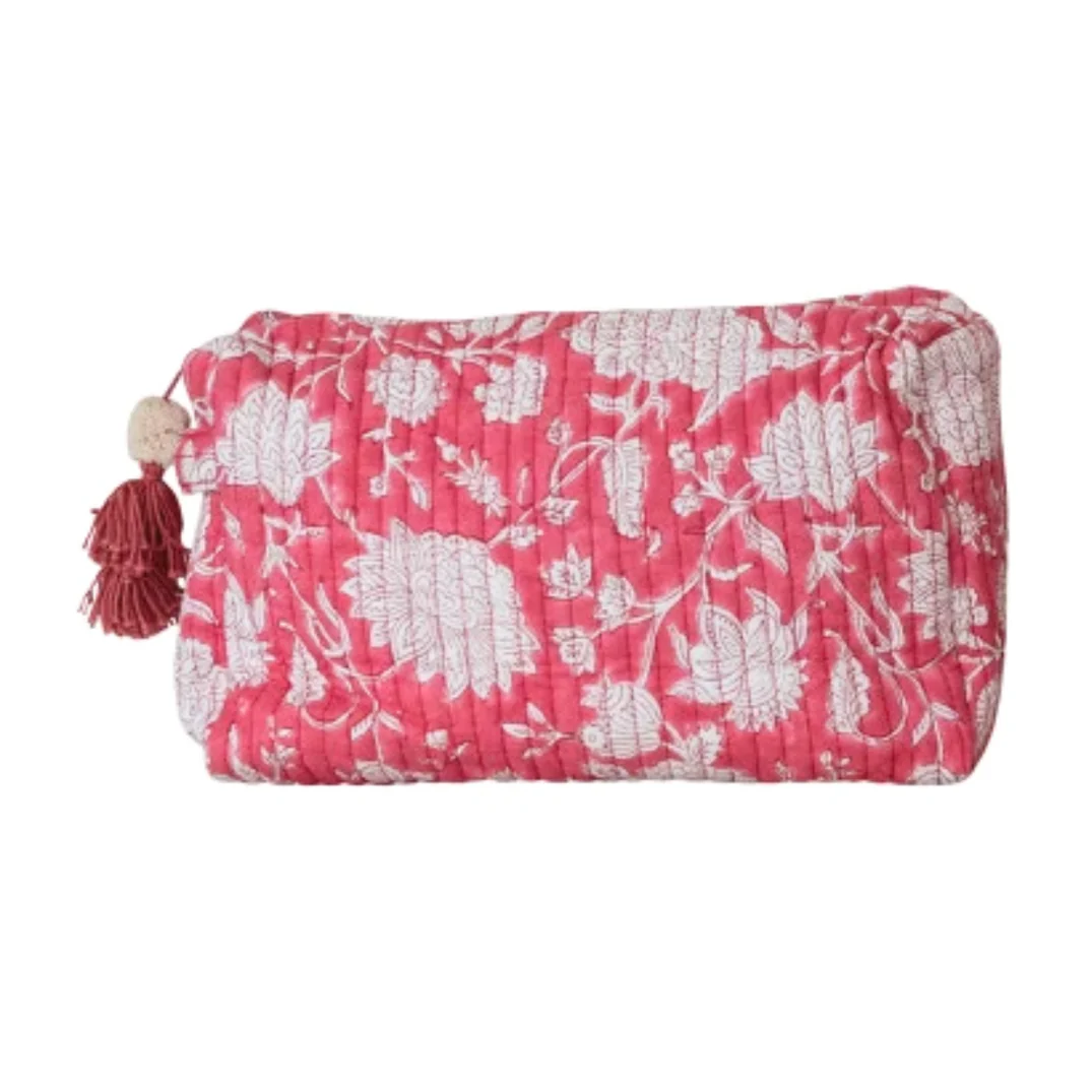 Floral patterned pouch with tassel on a white background