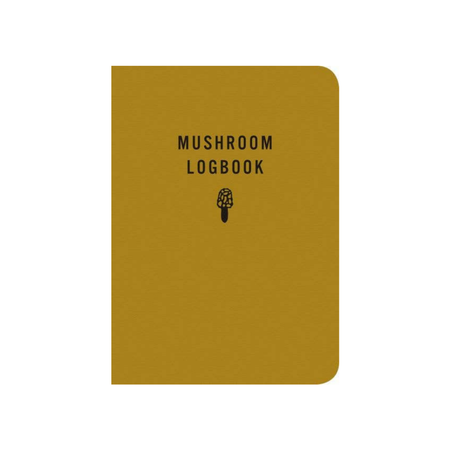 A softcover mushroom logbook with a textured mustard yellow cover and black printed text reading 'MUSHROOM LOGBOOK' along with a small mushroom illustration, shown on a plain white background.