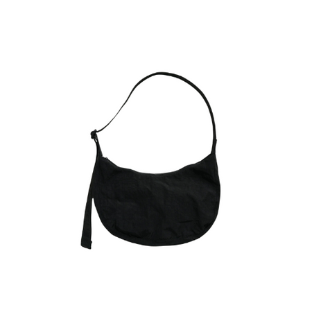 A black nylon crescent-shaped shoulder bag with an adjustable strap and a front zipper pocket.