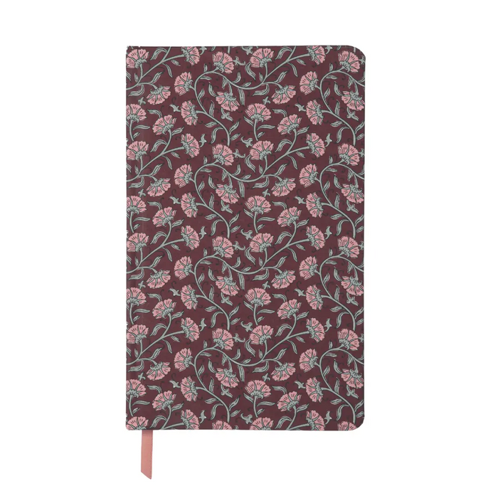 A hardcover notebook with a dark burgundy cover featuring an all-over pink and sage green floral vine pattern, with a matching pink ribbon bookmark hanging from the bottom.