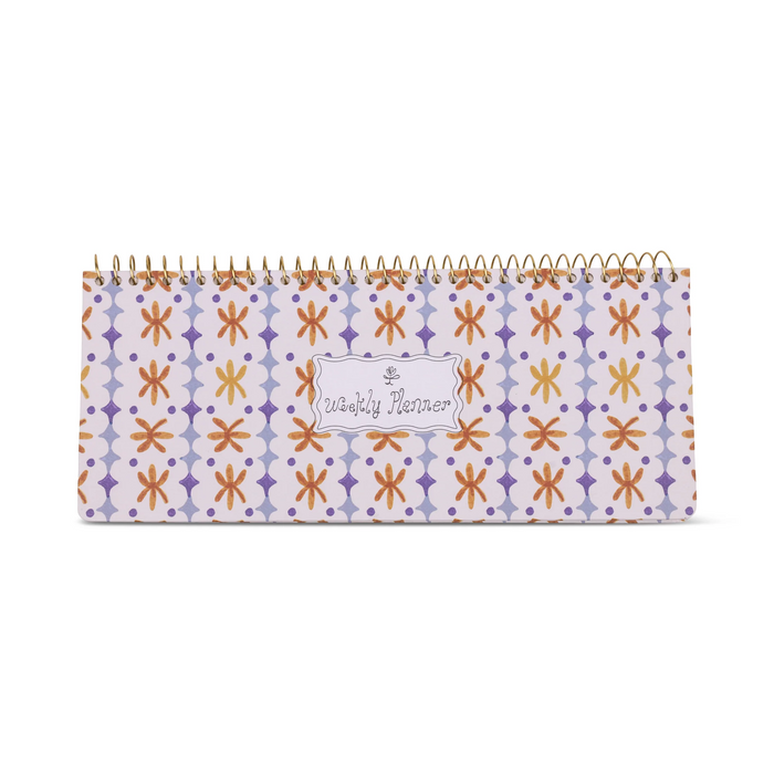 Patterned planner with spiral binding on a white background
