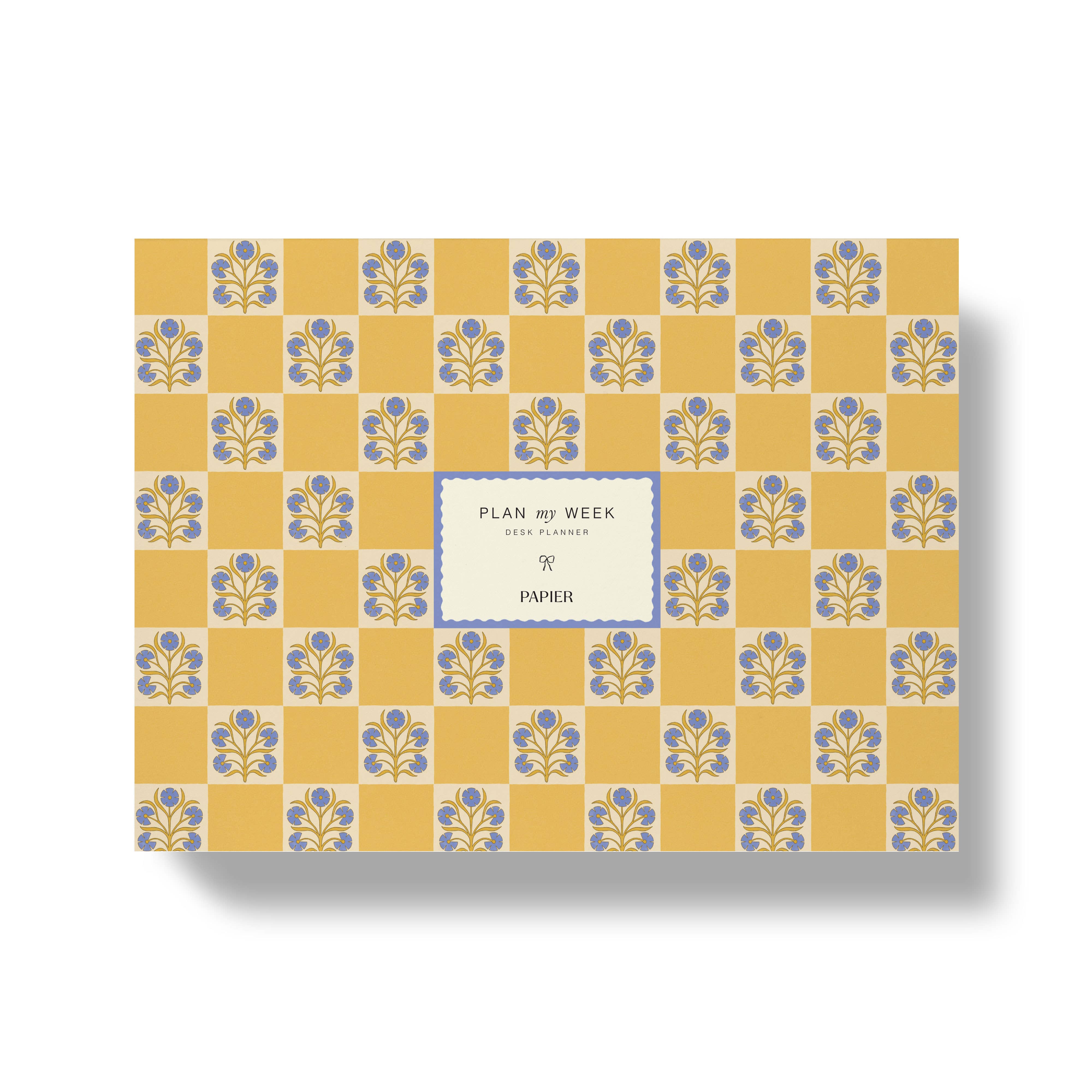Notebook with floral pattern and 'Papier' branding on a yellow background