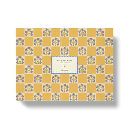 Notebook with floral pattern and 'Papier' branding on a yellow background