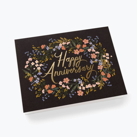 Greeting card with 'Happy Anniversary' text and floral design on a black background